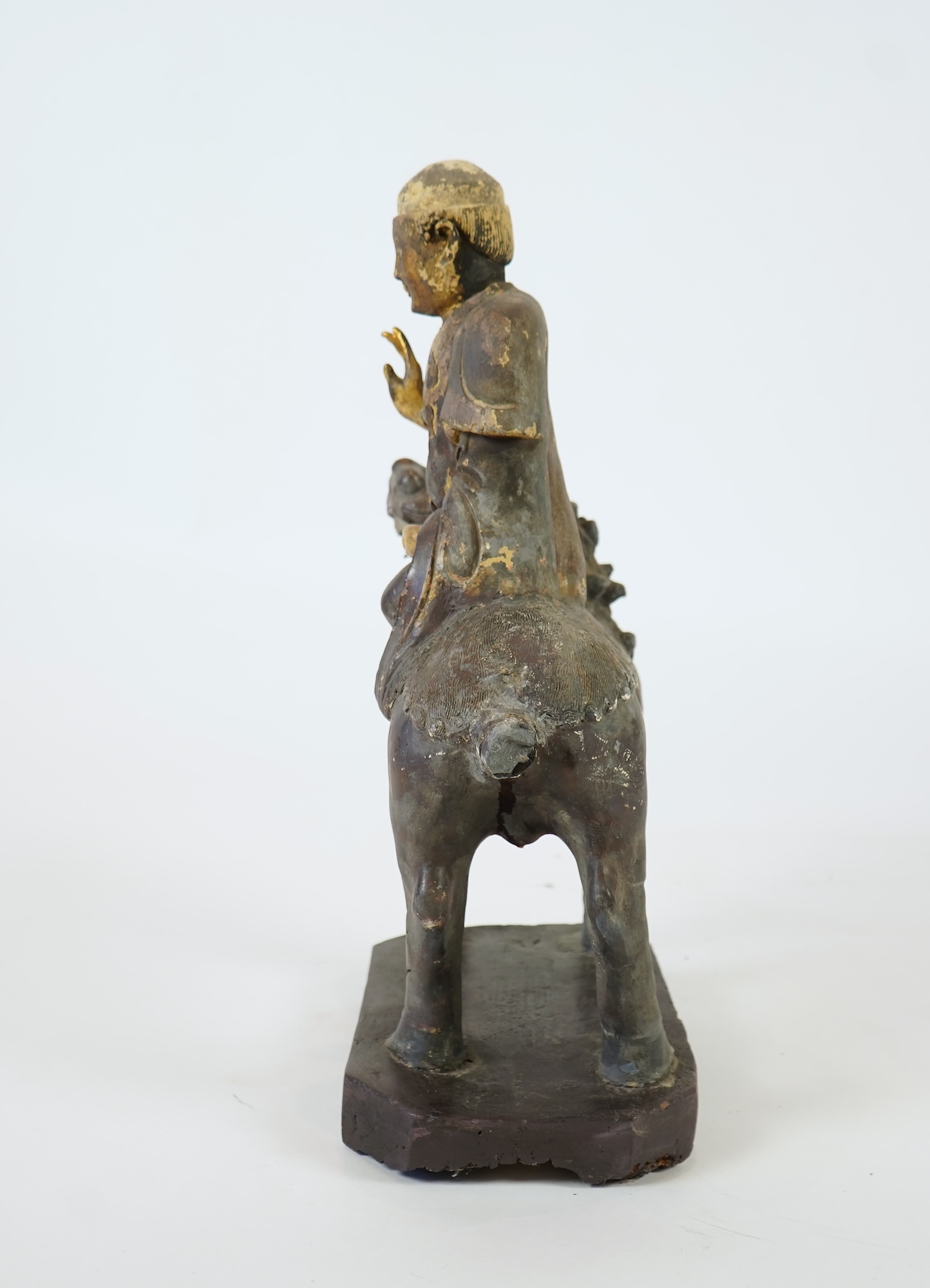 A Chinese gilt and polychrome lacquered stucco work and wood figure of Manjushri on a lion, Yuan-Ming dynasty